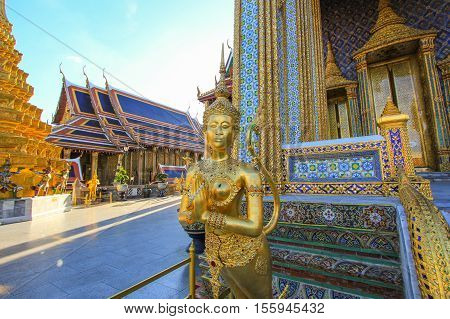 Golden statue in side public royal temple, Bangkok, Thailand