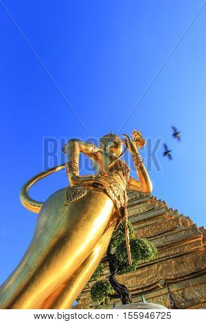 Golden statue in side public royal temple, Bangkok, Thailand