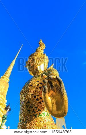 Golden statue in side public royal temple, Bangkok, Thailand