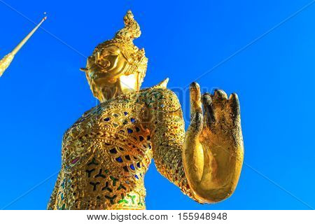 Golden statue in side public royal temple, Bangkok, Thailand