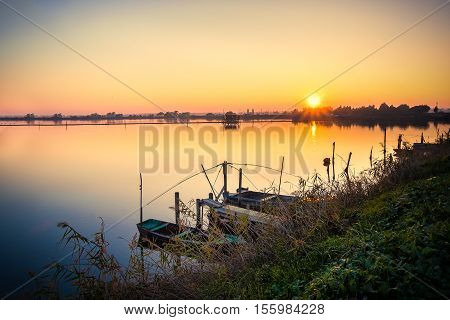 Brackish lagoon sun set over lake vignette landscape background