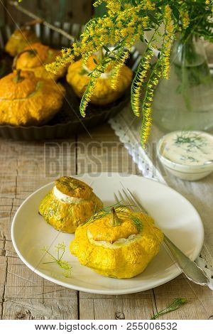Pattypan Squash Or Pumpkins Stuffed With Ricotta With Basil And Dill And Served With Sour Cream Sauc