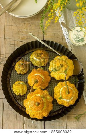 Pattypan Squash Or Pumpkins Stuffed With Ricotta With Basil And Dill And Served With Sour Cream Sauc