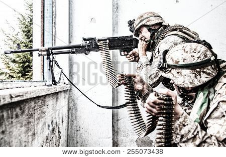 Army Machine Gunner Attacks Enemy With Aimed Fire