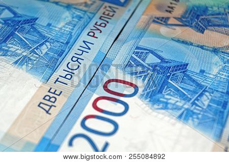 Russian Two Thousandth Notes Close-up Against The Background Of A Dark Wooden Table
