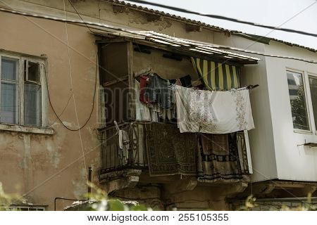 A Colorful Landscape Of Ruined Houses In A Poor Neighborhood For Poor People. Construction Of A Poor