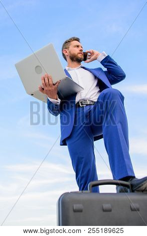 Man Well Groomed Businessman Holds Laptop Blue Sky Background. Confident Entrepreneur. Guy Formal Su
