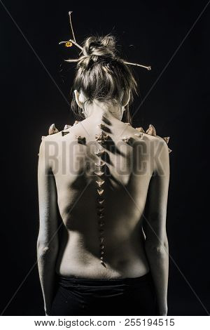 Girl With Fantasy Style Make Up. Woman With Thorns On Skinny Back And Shoulders Fantasy Creature. Ha