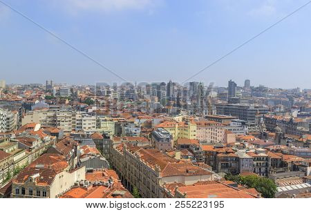 Scenic View Of Porto, Portugal From The Tower Clérigos Church. Orange Roofs Of The Houses. Popular T