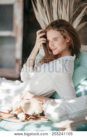 Portrait Of Beautiful Young Blonde Woman With Makeup In Fashion Clothes