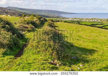 Hiking Trail With Farms And Houses In The Fanore Village In Background