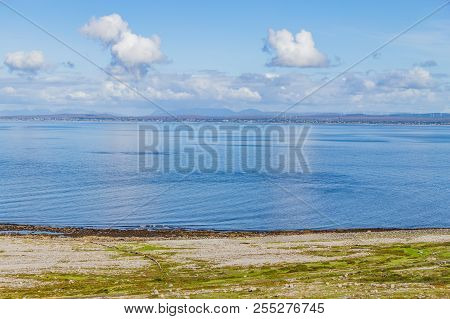 Fanore Beach In Burren Mountain With Galway Bay In Background