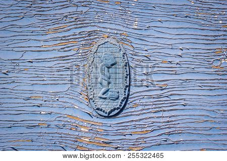 Symbol Pissing Boy, Restroom Sign On Wc / Toilet Door On Old Weathered Wooden Plank Painted In Blue 