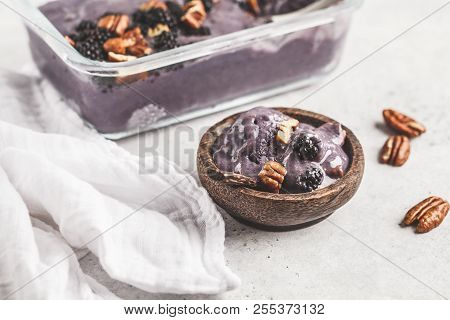 Homemade Berry Ice Cream In A Glass Container. Vegan Blackberry Ice Cream With Pecan And Coconut Cre