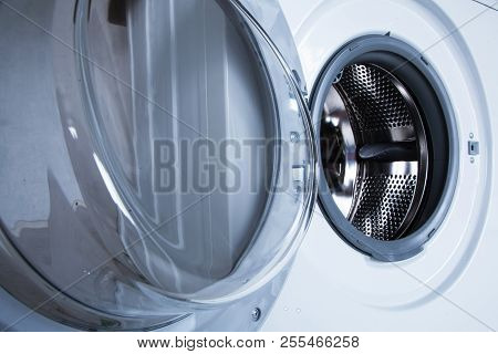 White Washing Machine Close-up. The Door Is Wide Open.