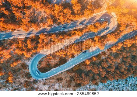 Aerial View Of Mountain Curve Road With Cars, Orange Forest At Sunset In Autumn In Europe. Landscape