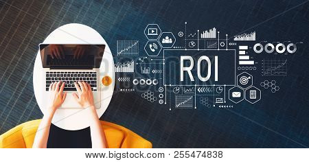 Roi With Person Using A Laptop On A White Table