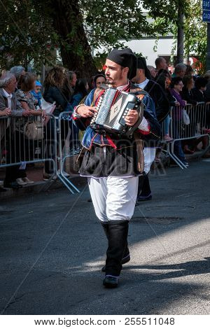 Sardinia, Italy. Feast Of The Redeemer, Musicians At The Parade Of Traditional Costumes.