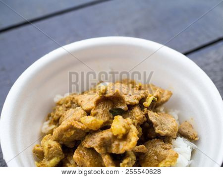 Close Up Red Curry Pork With Rice In Foam Cup