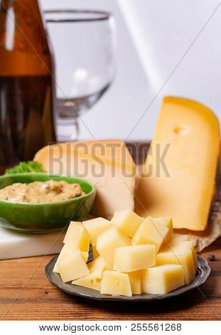 Dutch Finger Food Usually Served With Glass Of Beer, Cubes Hard Old Cows And Goat Cheese With Dijon
