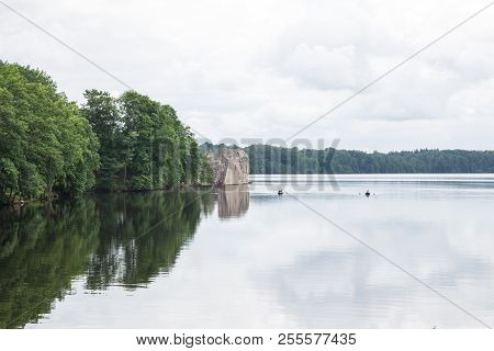 Latvia. Old River And Green Trees. Ruins And Reflection.