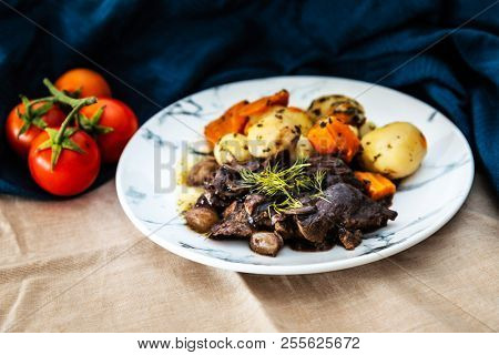 Beef meat stewed with potatoes-Traditional French cuisine Beef Bourguignon potatoes carrots in persillade