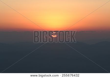Beautiful Sunrise On Mountain With Red Sky Background