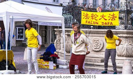 Salzburg, Austria - July 15, 2017: Unidentified Falun Dafa Members Demonstrate Traditional Chinese G