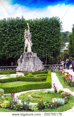 Salzburg, Austria - July 15,2017: Mirabell Garden Is The Most Beautiful Park In The City With Statue