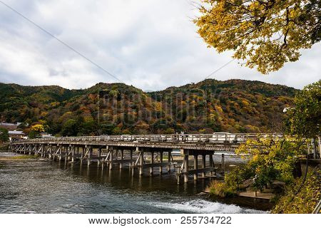 Togetsukyo Bridge Over Katsura River With Cooful Autumn Foliage Leaf At Mountain In Arashiyama, Kyot