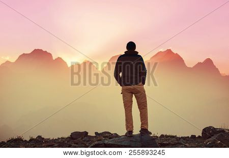 Wanderlust time. Man hiking in beautiful Fann mountains in Pamir, Tajikistan. Central Asia.