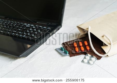 Medicines And Pills Next To Laptop, Notebook Keyboard. Stress In The Work, Anti Virus