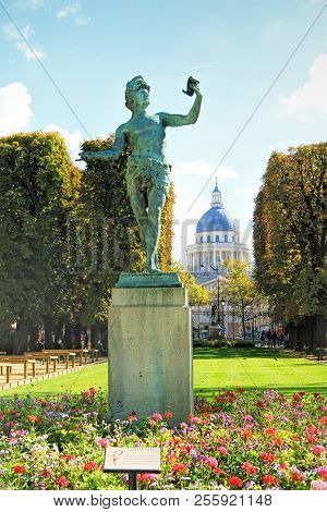 A Greek Actor (an Ancient Statue), Against The Background Of The Pantheon In The Luxembourg Garden P