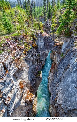 Natural Stone Bridge Spans The Deep And Narrow Marble Canyon With Turquoise Colored Waters From Toku