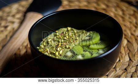 Avocado Mousse With Slices Kiwi And Crumbs Phistachios