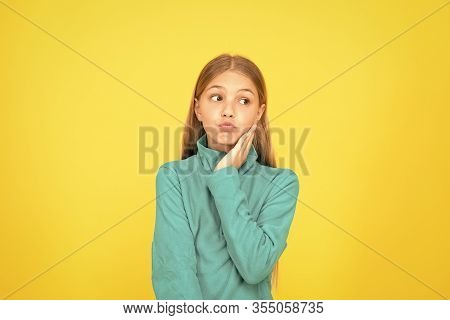 See Your Dentist As Soon As Possible. Little Child Suffer From Toothache Yellow Background. Anti Too
