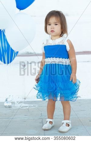 Pretty Baby In Blue Dresses On A Walk