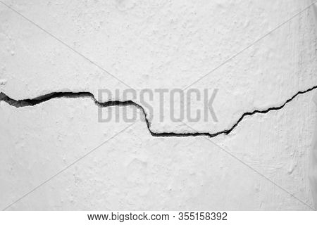 Crack In The White Wall. The Concept Of Schism Or Contradiction.