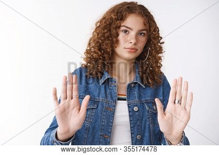 Disturbed Triggered Displeased Serious-looking Reluctant Redhead Girl Freckles Step Back Show Palms 