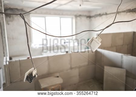 Selective Focus On The Wiring And Switches. Construction Of Internal Walls In The Apartment Using A 