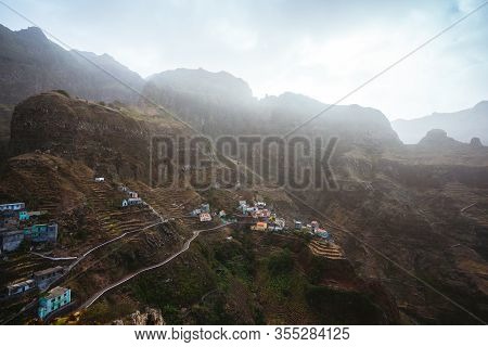 Fontaihas Settlement Village With Houses Nestle Into The Bluff Ridge Wall On Rocky Coast Of Santo An