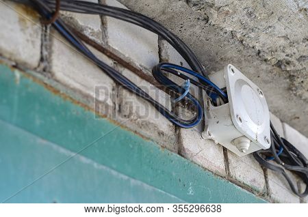 Junction Box For Wiring With Electrical Cables On The Wall. Wires In Black Insulation Are Included I