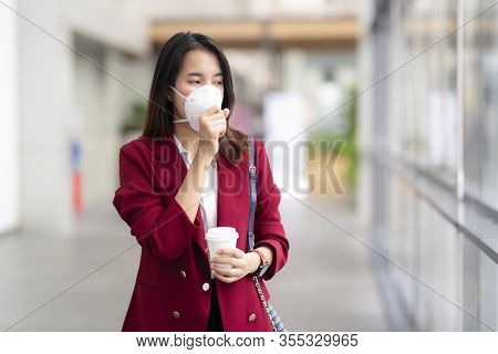 Asian Girl Use A Protection Mask For Prevent Pm 2.5 And Corona Viruus Or Covic 19 In Bangkok City.