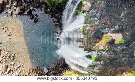 Looking Down Aerial View Of The High Waterfall Jeongbang And Lagoon On Jeju Island, South Korea.