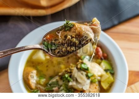 Italian Chicken Sausage Minestrone Soup Au Pistou Topped With Basil Pesto And Grated Parmesan Cheese