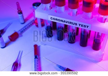 Coronavirus Blood Test Concept. Analyzing Blood Sample In Test Tube For Coronavirus Test. Test Tube