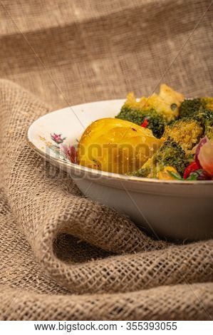 Vvegetable Salad In A White Ceramic Bowl On A Background Of Coarse Fabric. Close Up.egetable Salad, 