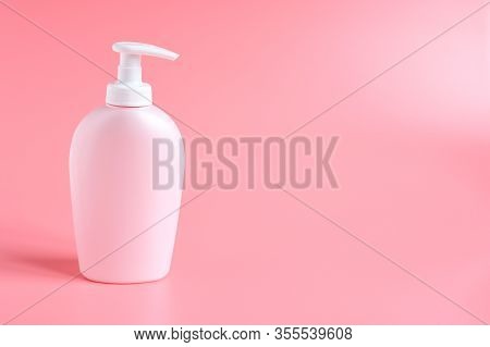 Pink Plastic Bottle With White Pump For Liquid Soap  Or Bodycream Care, Cosmetique On Pink Backgroun