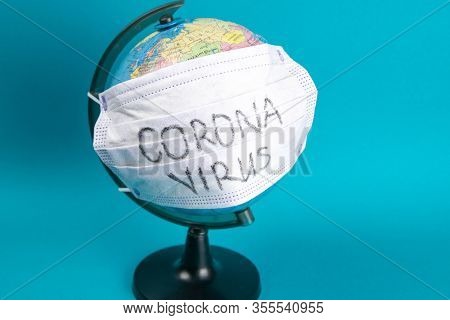 World Corona Virus Attack Concept. World Earth Put Mask To Fight Against Corona Virus. Concept Of Fi