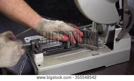 Grinding In Steel Manufactory. Working Man With Big Saw Cutting Metal.